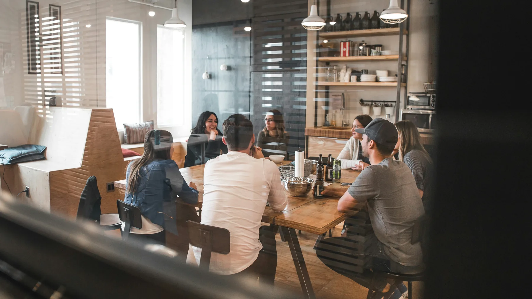 A creative team sharing ideas around a table